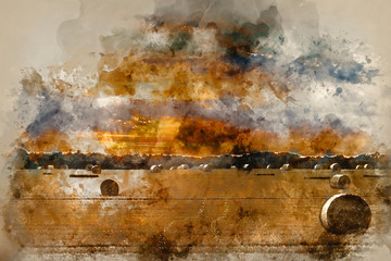 Watercolour painting of Beautiful countryside landscape image of hay bales in Summer field during colorful sunset © veneratio