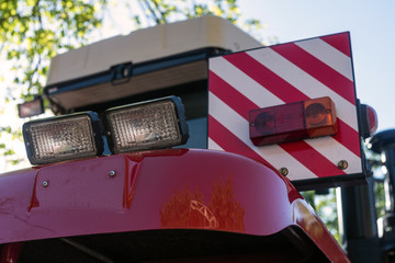 red tractor tail lights in the parking lot