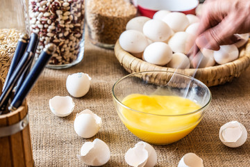 Stir a spoonful of raw eggs in a glass dish.