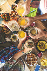 Toast with friend dinner on the terrace enjoying together. Summer aperitif with group of friends....