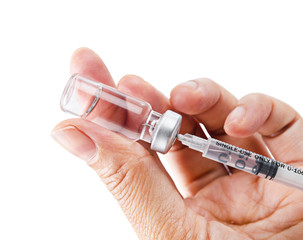 Syringe, medical injection vaccination in hand.