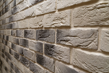 Modern briwall with decorative light brick. repair and construction.ck wall (monochrome photo).