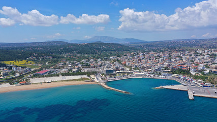 Aerial drone bird's eye panoramic view of famous port and city of Rafina with passenger ferries travel to Aegean islands, Attica, Greece