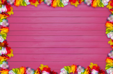 Hawaiian flowers on planks background