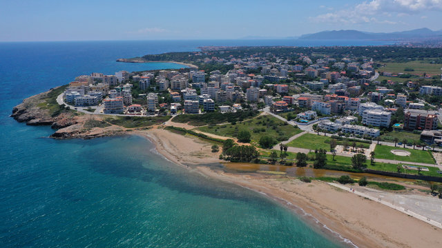 Aerial drone bird's eye panoramic view of famous port and city of Rafina with passenger ferries travel to Aegean islands, Attica, Greece