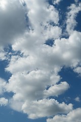 Beautiful cloudscape in blue sky, natural fluffy clouds background 