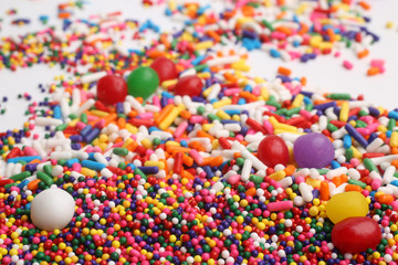 Fototapeta na wymiar Assorted colored sprinkles, for backgrounds or textures