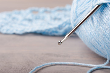 blue yarn and crochet hook