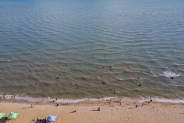 Aerial View From Flying Drone Of People Crowd Relaxing On Beach In Cambodia - Image in Kampot - Cambodia