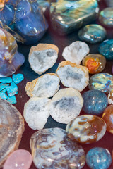 Heap of various colored gems. Colorful gemstones. Natural Polished Gemstone Semi Precious Rocks Colorful Background Texture Close Up Phot. vertical photo
