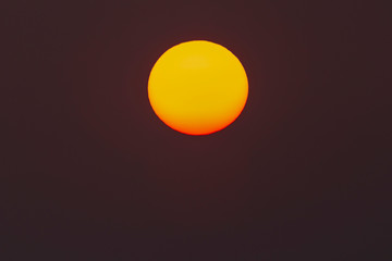 The evening or morning sun can be seen with the naked eye. The sun is red because of the dust and atmosphere.