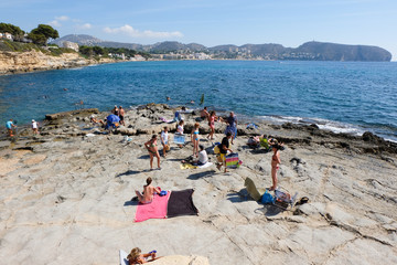 Moraira, Alicante, Spain. September 14, 2014. View of Cala L' Andragó full of bathers who come to bathe in its clean waters