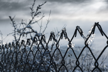 barbed wire on background of blue sky