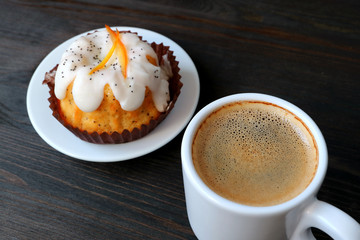 Cup of Hot Coffee with Orange Poppy Seed Yogurt Cake Served on Wooden Table