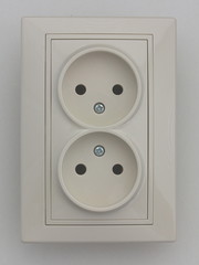 European 220 v electrical outlet socket without ground contact on the wall, vertical installation