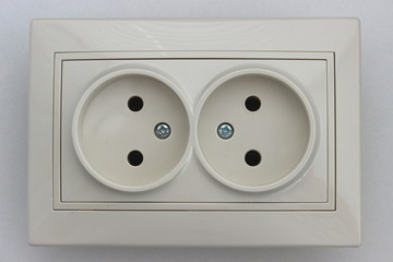 European 220 v electrical outlet socket without ground contact on the wall, horizontal mounting