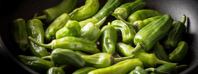 Green Padron Peppers in the Frying Pan. Pimientos de Padron.