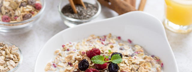 Healthy Breakfast Muesli With Milk, Chia Seeds, Berries and Cinnamon. Sunny Morning.