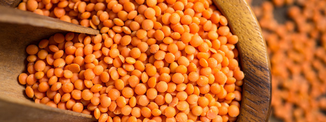 Red Lentils in Bowl on Wooden Table