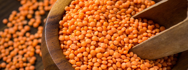 Red Lentils in Bowl on Wooden Table