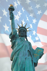 Double exposure of statue of liberty and American flag for independence day.