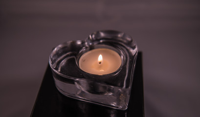 Tea light in a heart form, love and Valentine's Day concept.