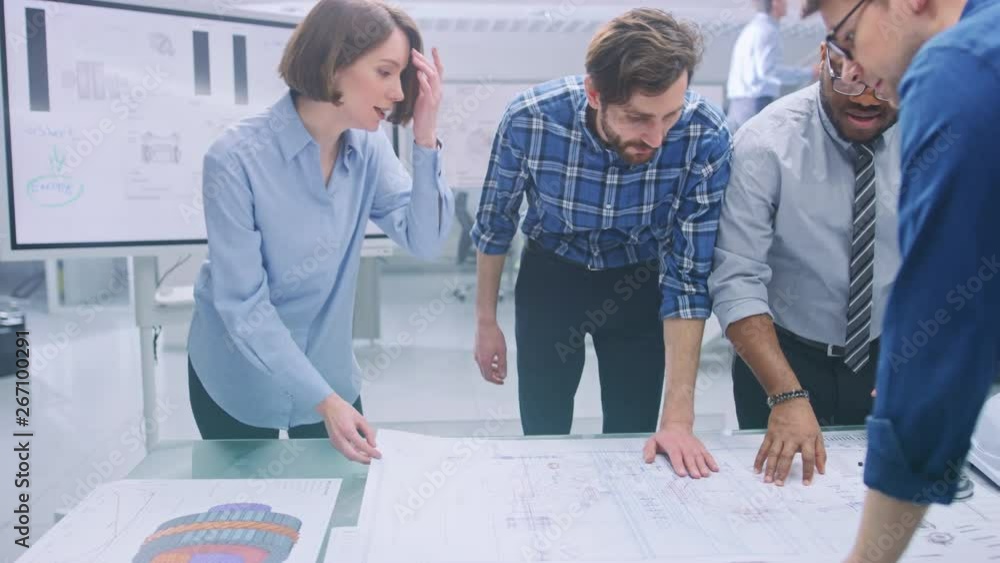 Poster in the industrial engineering facility: diverse group of engineers and technicians on a meeting gath