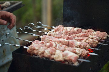 Raw meat shish kebab on the grill. Skewer set of meat.Fast food