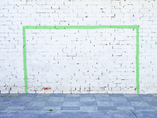 Soccer, football goal painted on a white wall