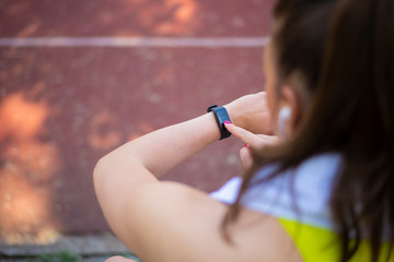 Sporty woman using smart watch
