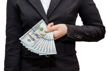 Female hands hold dollars on a white background.