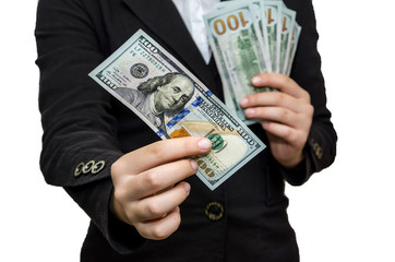 Female hands hold dollars on a white background.