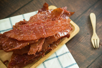 Sliced sheets of dried and crispy pork