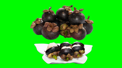 Obraz na płótnie Canvas Mangosteen fruit in the dish that cuts the background makes it green.