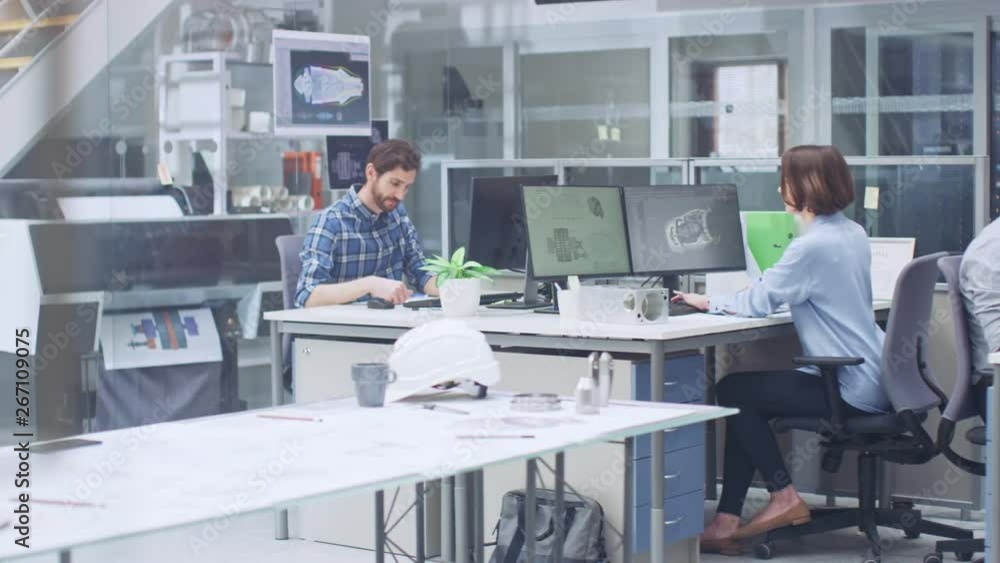 Poster In the Industrial Engineering Facility: Diverse Group of Engineers, Technicians, and Specialists on a Meeting, Have Discussion, Analyse Engine Design Technical Drafts that are Lying on the Table