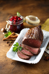 Homemade roast beef with cherry sauce