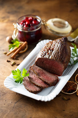 Homemade roast beef with cherry sauce