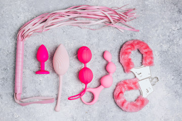 Different sex toys set on a light background.