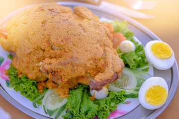 roasted curry chicken with eggs in a plate. Selective focus