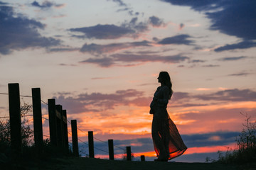 Fototapeta na wymiar pregnant woman silhouette sunset