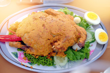 roasted curry chicken with eggs in a plate. Selective focus