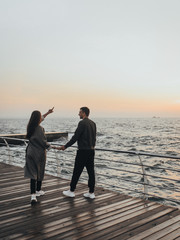 Fototapeta premium beautiful loving couple walking at sunset