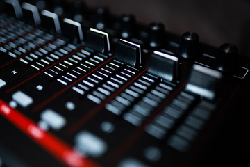Fototapeta na wymiar Keyboard / electronical piano for recording music in a studio: volume sliders