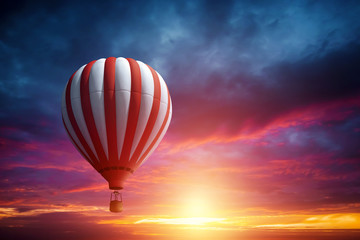 Multicolored, large balloons in the sky against the backdrop of a beautiful sunset. Concept of travel, dream, new emotions.