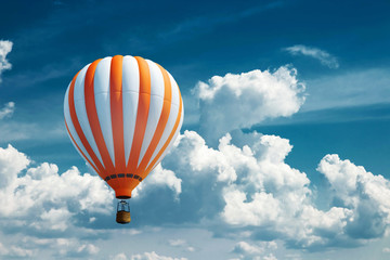 Multicolored, large balloons against the blue sky. Travel concept, dream, new emotions, travel...