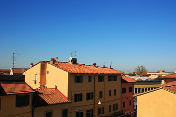Fototapeta na wymiar Tiled roofs of old Italian houses