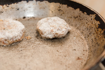 Cutlets are roasted in an old frying pan. Buckwheat cutlets. Buckwheat cutlets are fried. Veggie cutlets. natural food.