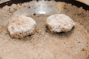 Cutlets are roasted in an old frying pan. Buckwheat cutlets. Buckwheat cutlets are fried. Veggie cutlets. natural food.