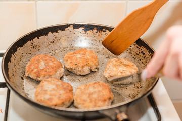 Cutlets are roasted in an old frying pan. Buckwheat cutlets. Buckwheat cutlets are fried. Veggie cutlets. natural food.