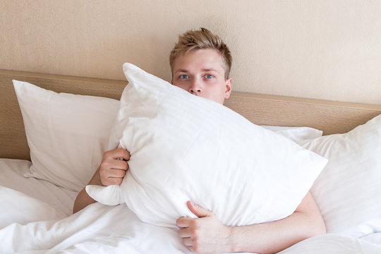 Funny Guy In Bed Under The Blanket After Sleeping. Sleepy Man Waking Up